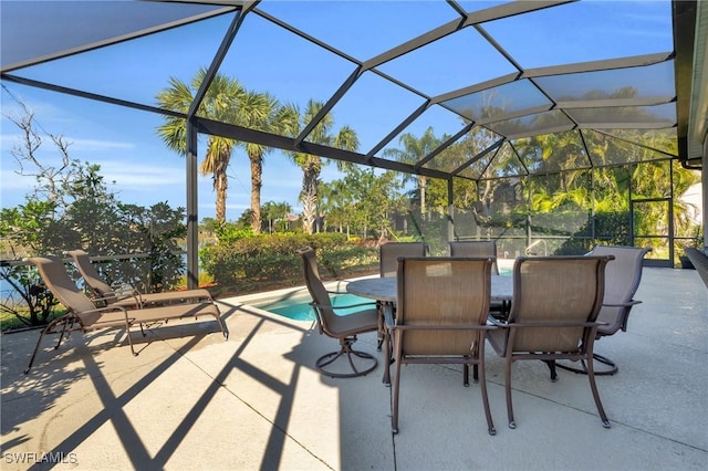 view of patio featuring a lanai