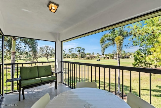 sunroom / solarium with view of golf course