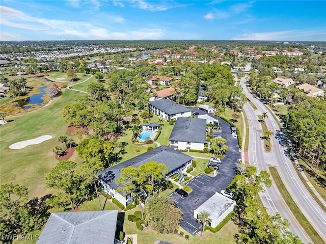 birds eye view of property with view of golf course