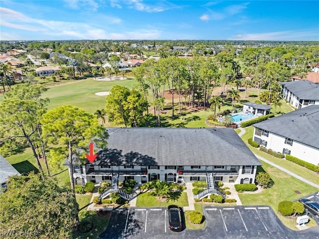 aerial view with view of golf course and a residential view
