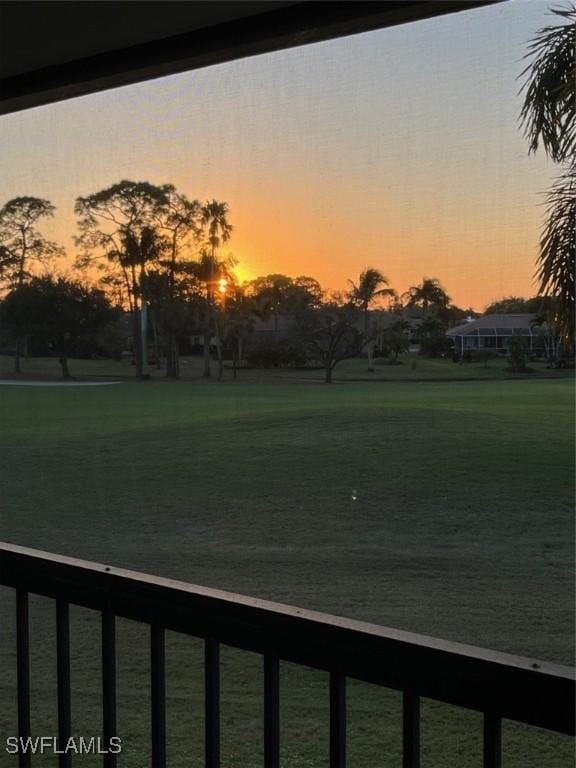 view of yard at dusk