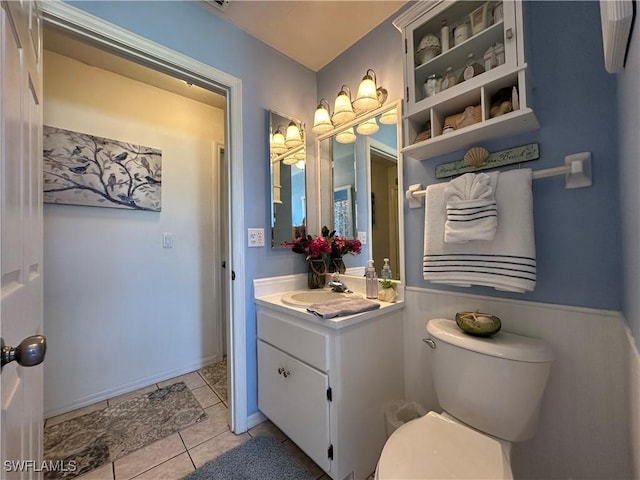 bathroom with vanity, tile patterned floors, and toilet