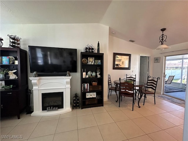 tiled living room with vaulted ceiling