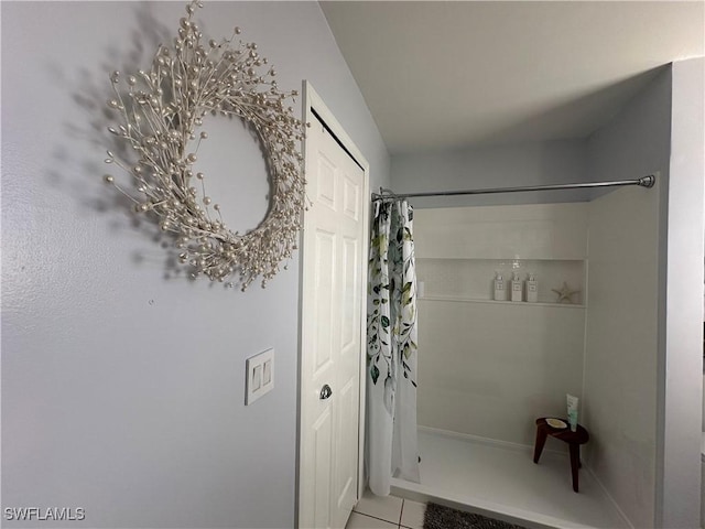 bathroom featuring a shower with curtain and tile patterned floors