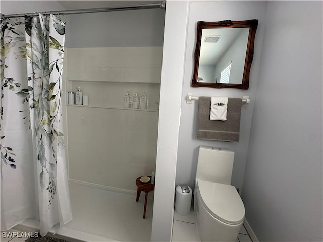 bathroom with walk in shower and toilet