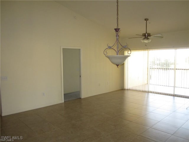 tiled empty room featuring high vaulted ceiling and ceiling fan