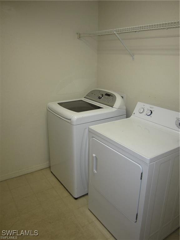 clothes washing area featuring washing machine and dryer