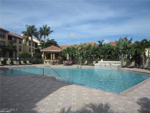 view of swimming pool with a gazebo, a jacuzzi, and a patio area