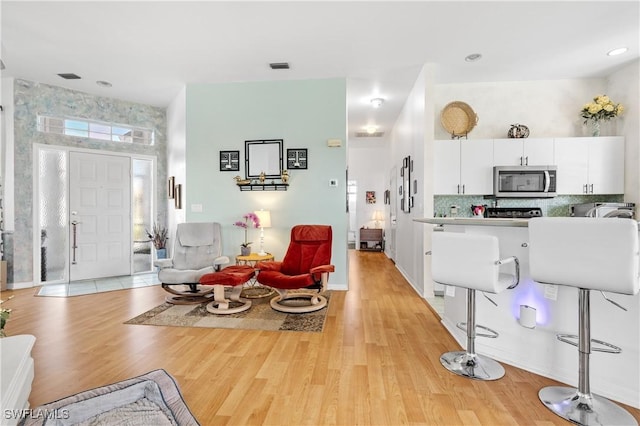 living room with light hardwood / wood-style floors