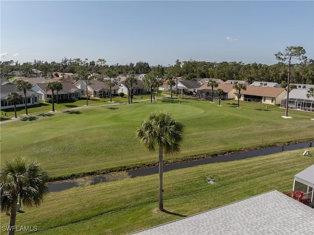 view of property's community with a lawn