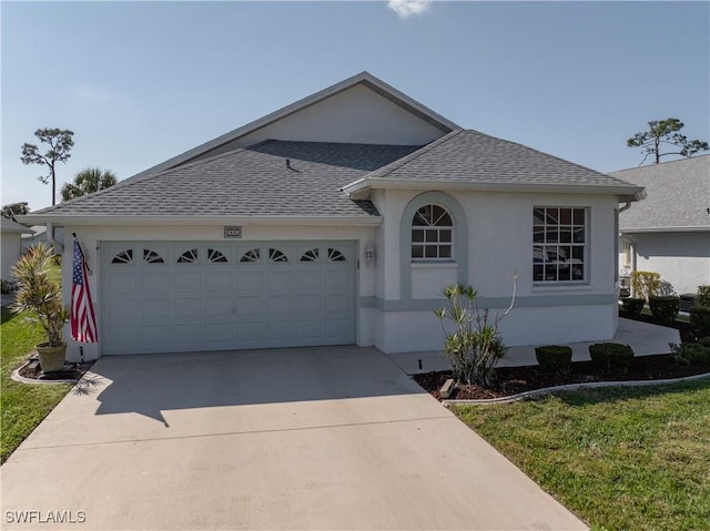 ranch-style house with a garage and a front lawn