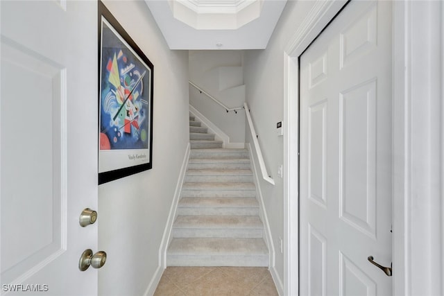 stairs featuring tile patterned flooring