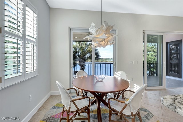 dining area with a healthy amount of sunlight and light tile patterned floors