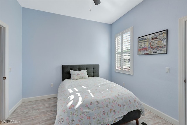 bedroom featuring ceiling fan and light hardwood / wood-style flooring