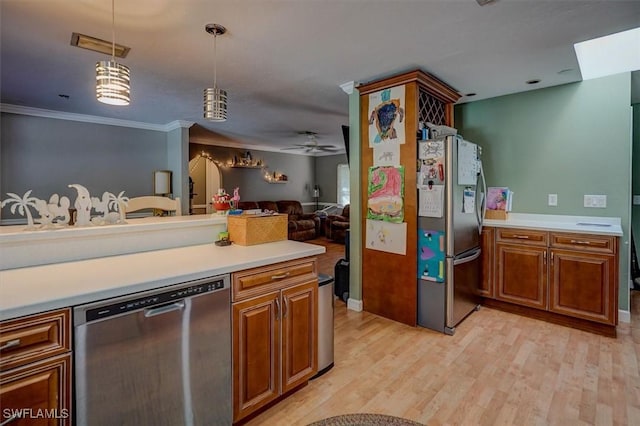 kitchen featuring appliances with stainless steel finishes, hanging light fixtures, ornamental molding, ceiling fan, and light hardwood / wood-style flooring