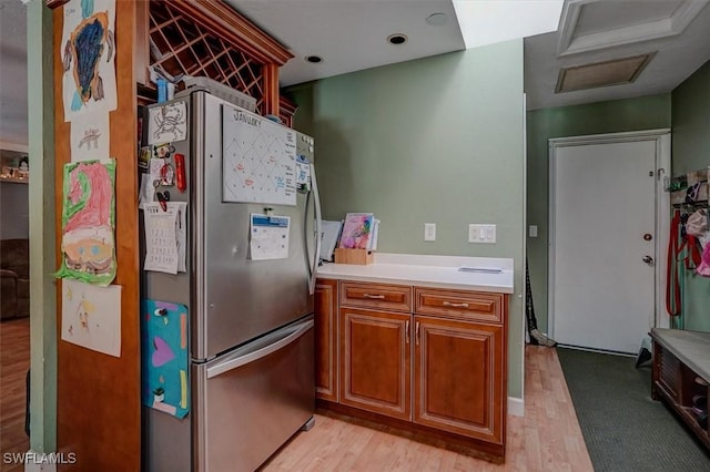 kitchen featuring stainless steel refrigerator and light wood-type flooring