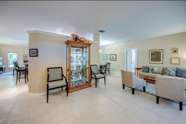 tiled living room featuring ornamental molding