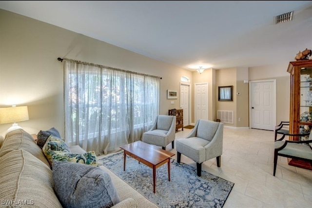 living room with light tile patterned floors