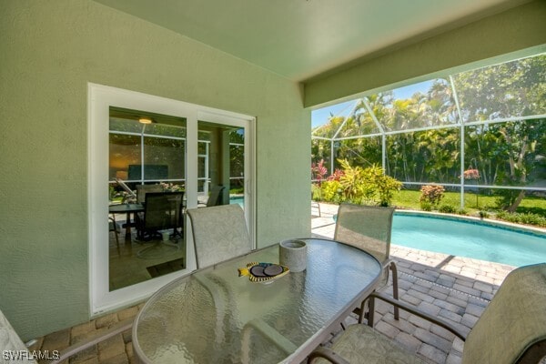 view of patio / terrace with glass enclosure