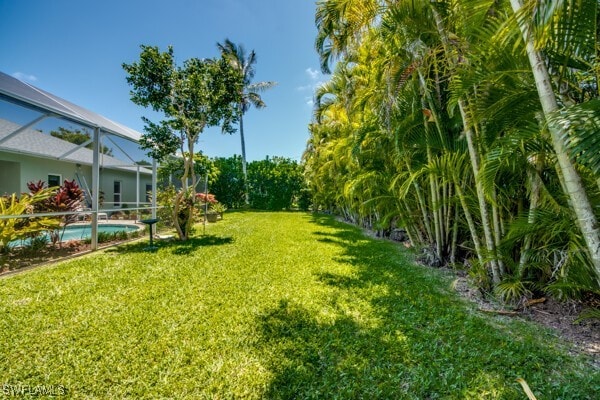 view of yard featuring a lanai