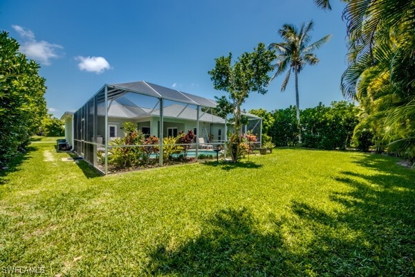 view of yard featuring glass enclosure