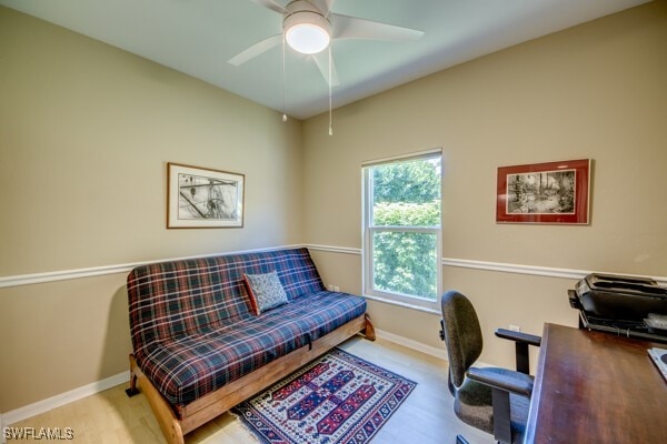 office space with ceiling fan and light wood-type flooring