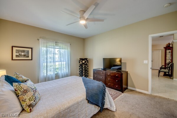 carpeted bedroom featuring ceiling fan