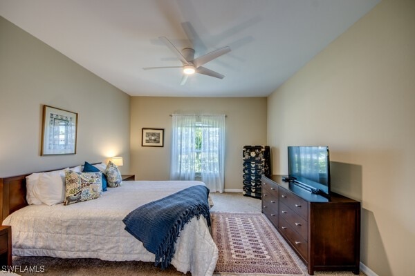 carpeted bedroom with ceiling fan