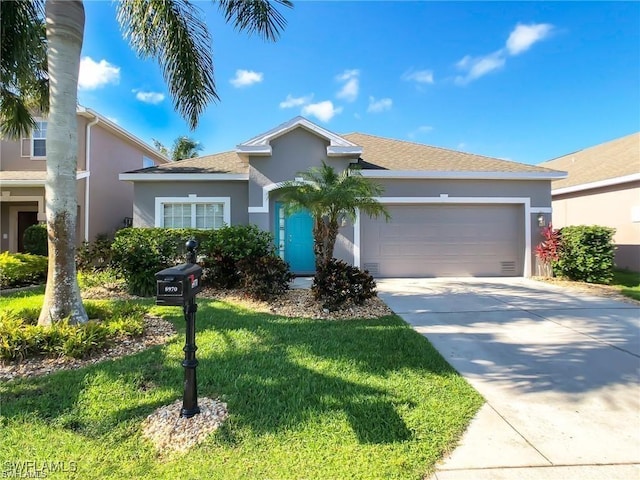 ranch-style home with a garage and a front yard