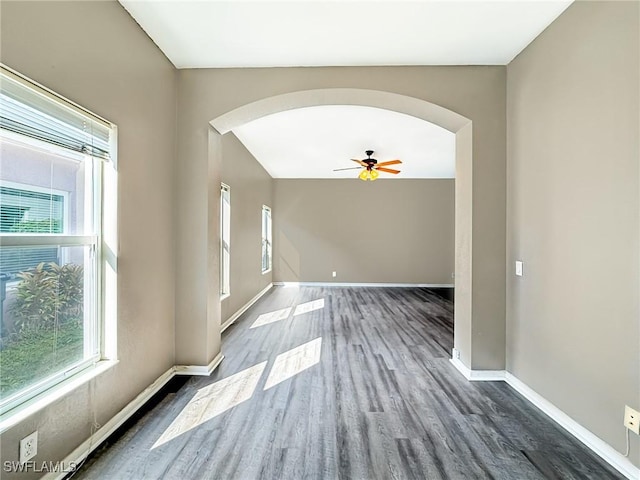 interior space featuring ceiling fan and dark hardwood / wood-style floors