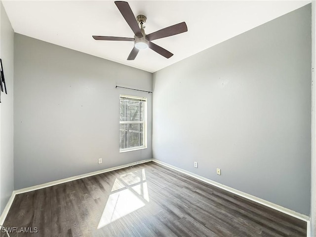 unfurnished room featuring dark hardwood / wood-style floors and ceiling fan