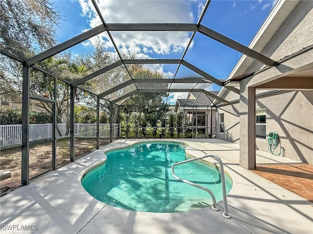 view of pool with a lanai and a patio