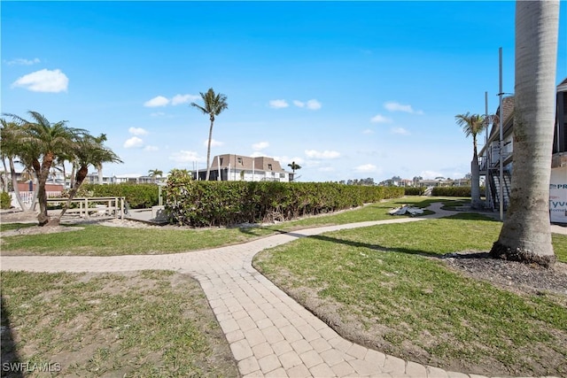 view of property's community featuring a yard