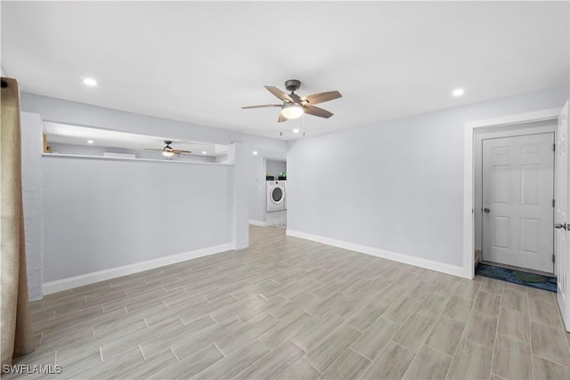 unfurnished living room featuring ceiling fan, separate washer and dryer, and light hardwood / wood-style flooring