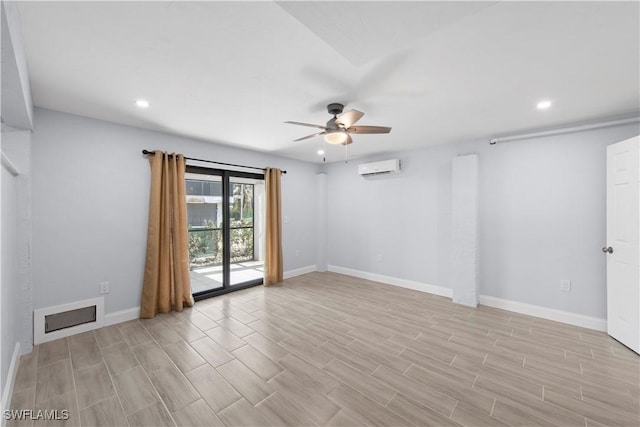 spare room featuring ceiling fan and a wall mounted AC