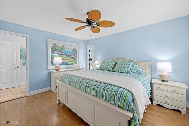 bedroom with light hardwood / wood-style floors and ceiling fan