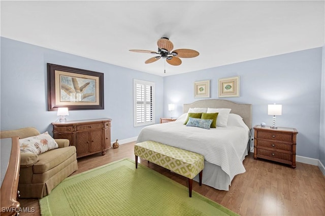 bedroom with light hardwood / wood-style flooring and ceiling fan