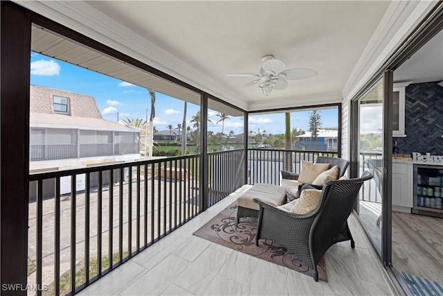 sunroom / solarium with wine cooler and ceiling fan