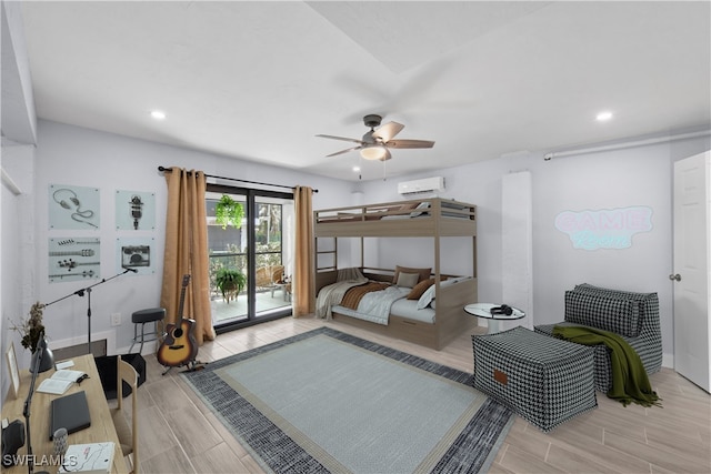 bedroom featuring ceiling fan, a wall mounted air conditioner, and access to exterior