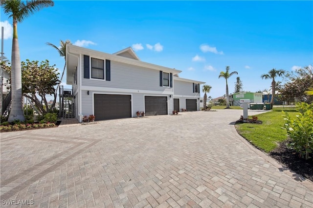 front facade with a garage