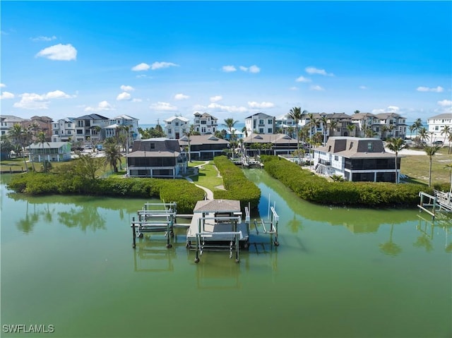 26773 Hickory Blvd Unit 2, Bonita Springs, FL 34134 - dock area with a residential view, boat lift, and a water view