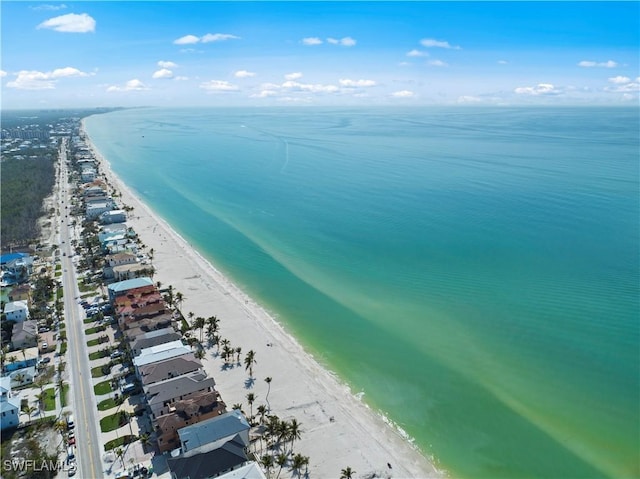 bird's eye view with a view of the beach and a water view