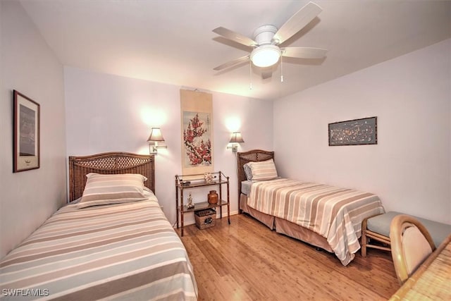 bedroom featuring ceiling fan and light hardwood / wood-style flooring