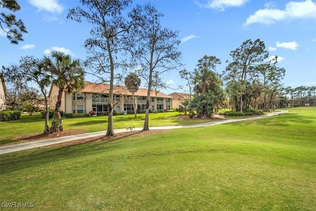 view of community featuring a yard