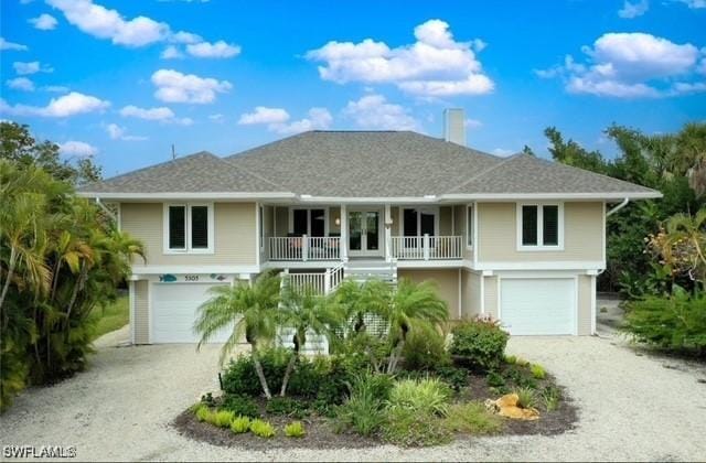 view of front facade with a garage and covered porch