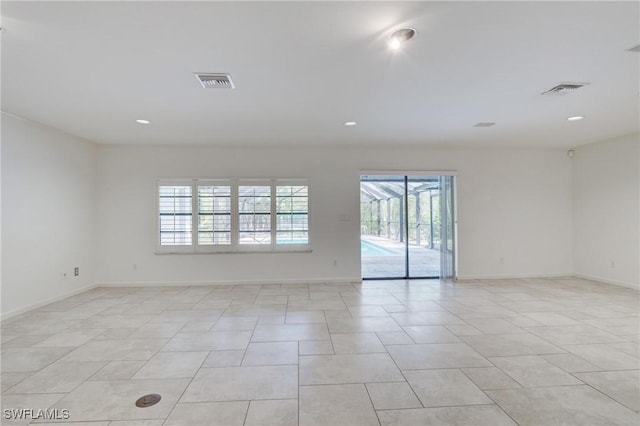 view of tiled spare room