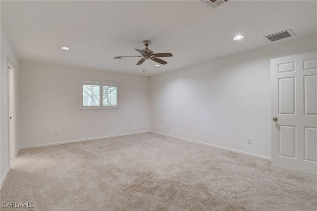 carpeted empty room featuring ceiling fan