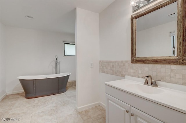 bathroom with vanity, tile patterned flooring, and a bathing tub