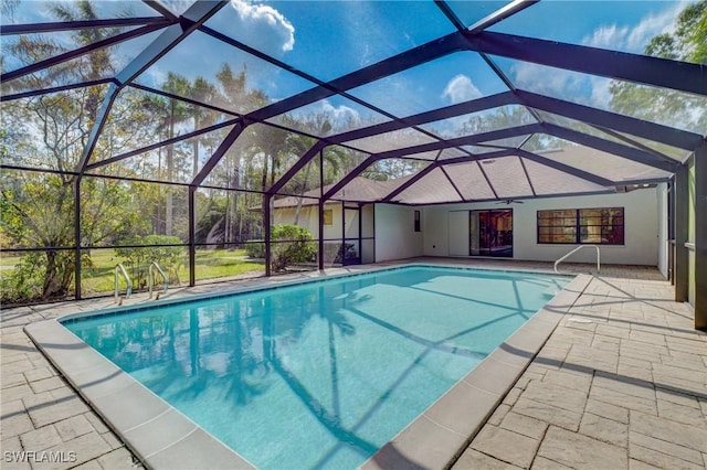 view of pool featuring a lanai and a patio area