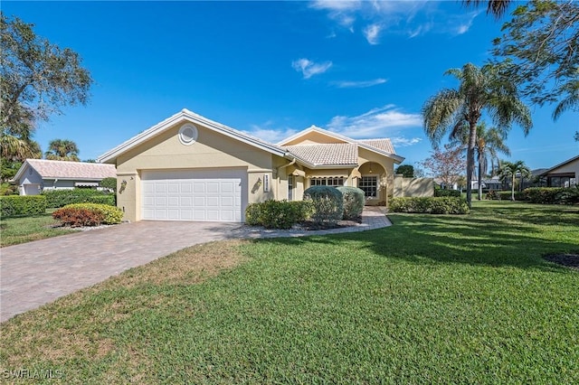 view of front facade with a garage and a front yard